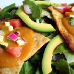 Crunchy Tortilla Delight: Beans, Cheese, Lettuce & Sauce