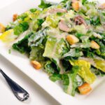 The Timeless Charm of Caesar Salad: Origins and Recipe Tips