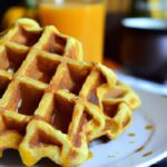Cozy Pumpkin Spice Waffles Drizzled with Maple Syrup
