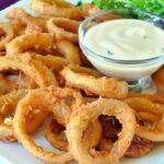 Golden Crispy Onion Rings Paired Perfectly with Ranch Dip