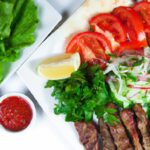 Savor the Flavors: Lamb Kebab with Pita and Fresh Salad